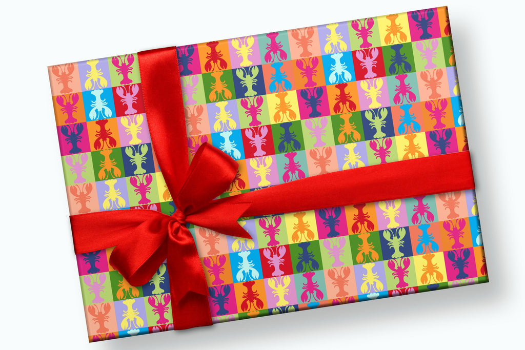 Gift wrapped with paper with colorful rectangles and one lobster inside the rectangle in a contrasting color